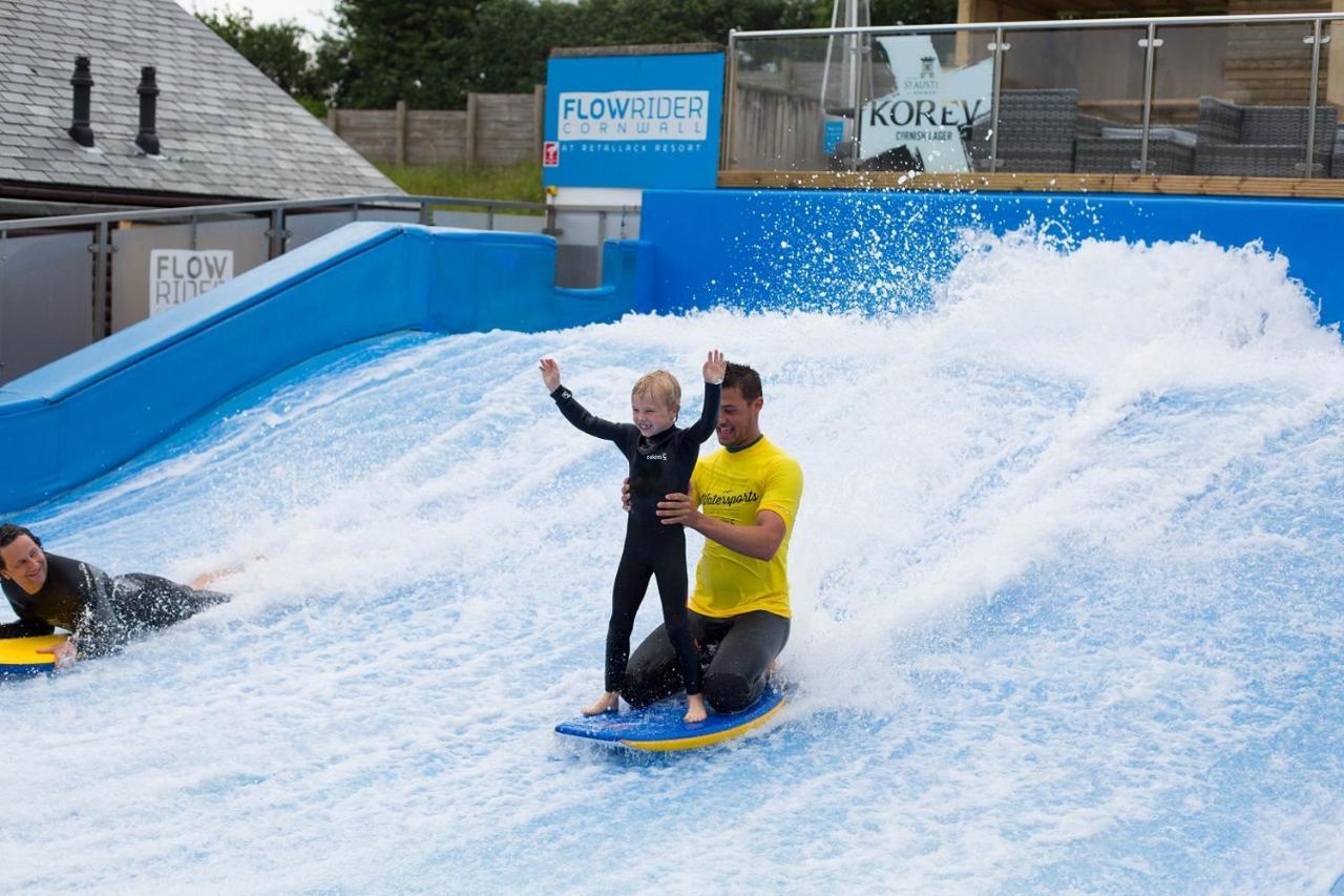 Retallack Resort & Spa Padstow Luaran gambar A child learning to surf on the FlowRider